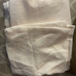 2 cream sheer curtains